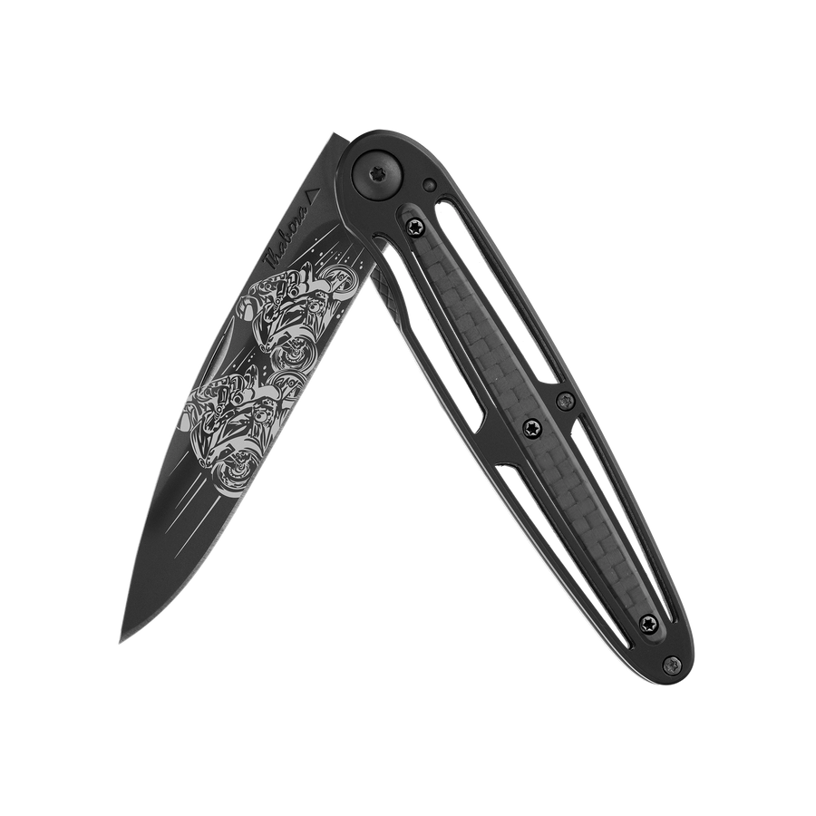 Couteau acier finition titane noir plaquette centrale carbone motif «motos de course»