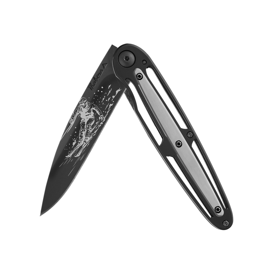 Couteau acier finition titane noir plaquette centrale acier brossé motif «skieur»