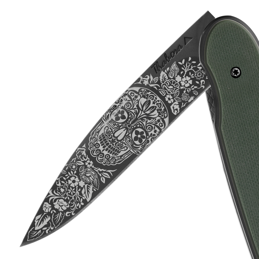 Couteau acier finition titane noir plaquette pleine résine g10 kaki motif «tête mexicaine»
