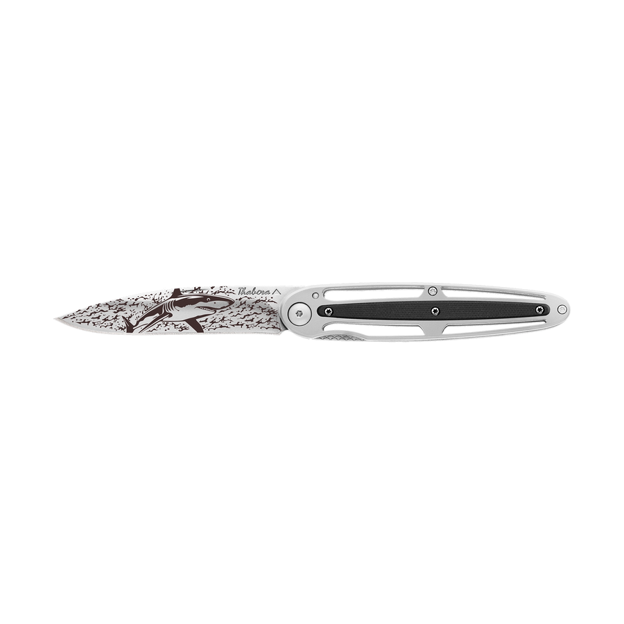 Couteau acier finition brillante plaquette centrale résine g10 noir motif «requin»