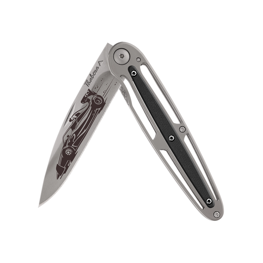 Couteau acier finition titane gris plaquette centrale résine g10 noir motif «formule 1»