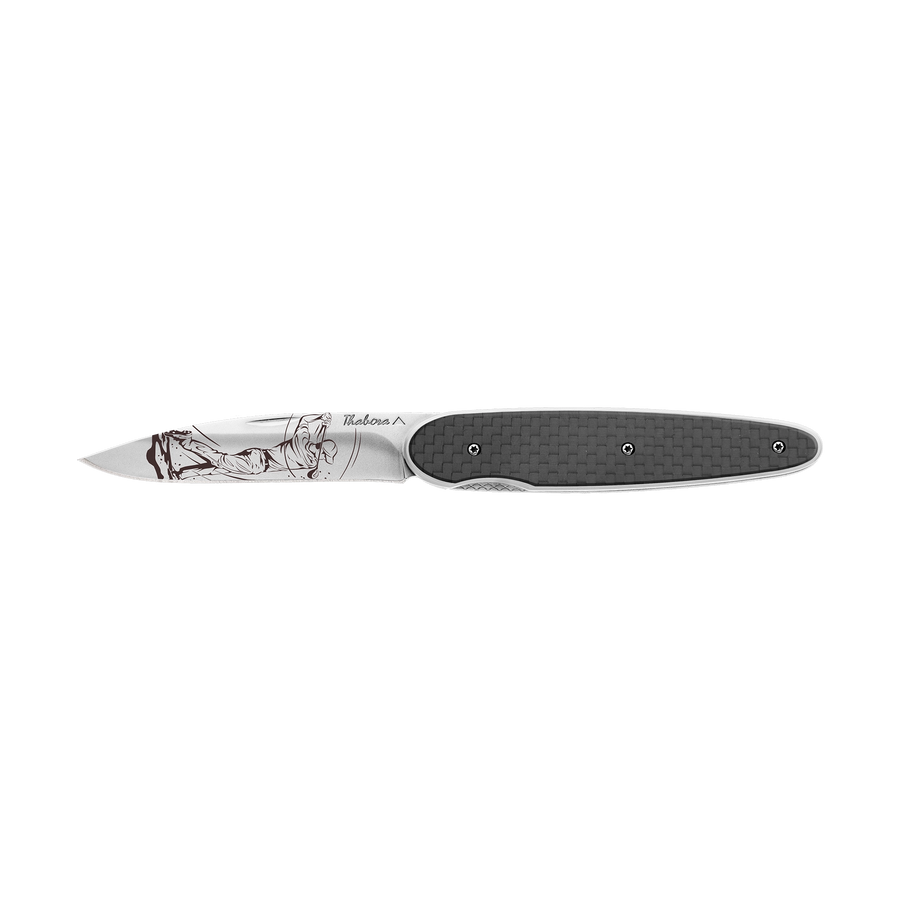 Couteau acier finition brillante plaquette pleine carbone motif «golfeur»
