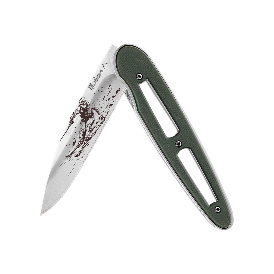 Couteau acier finition brillante plaquette ajourée résine g10 kaki motif «skieur»