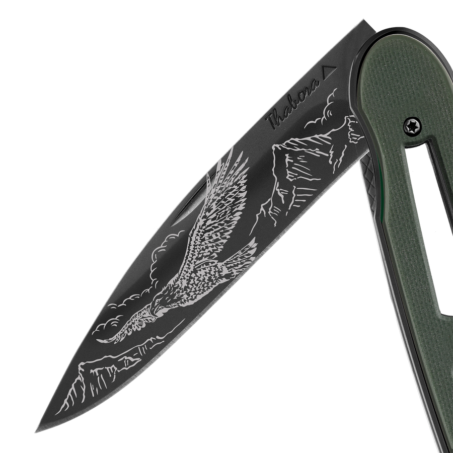 Couteau acier finition titane noir plaquette ajourée résine g10 kaki motif «aigle»