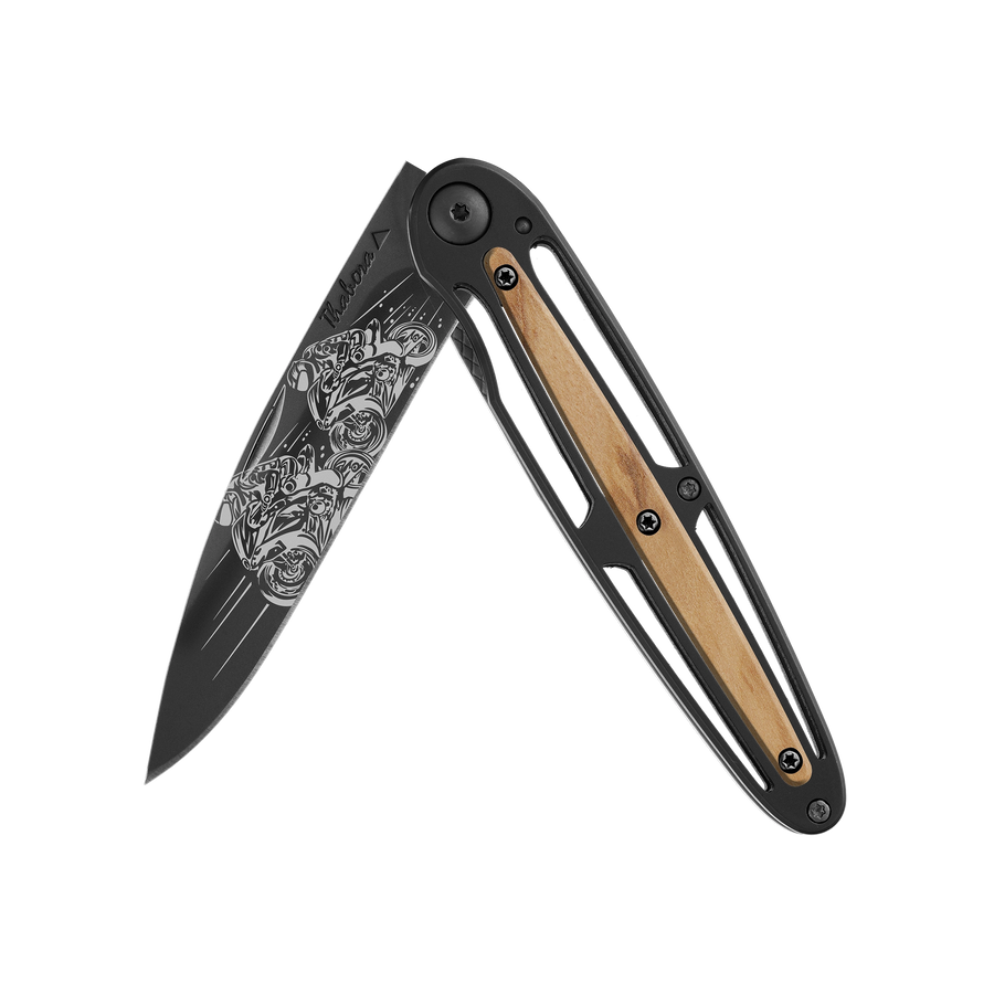 Couteau acier finition titane noir plaquette centrale bois clair motif «motos de course»