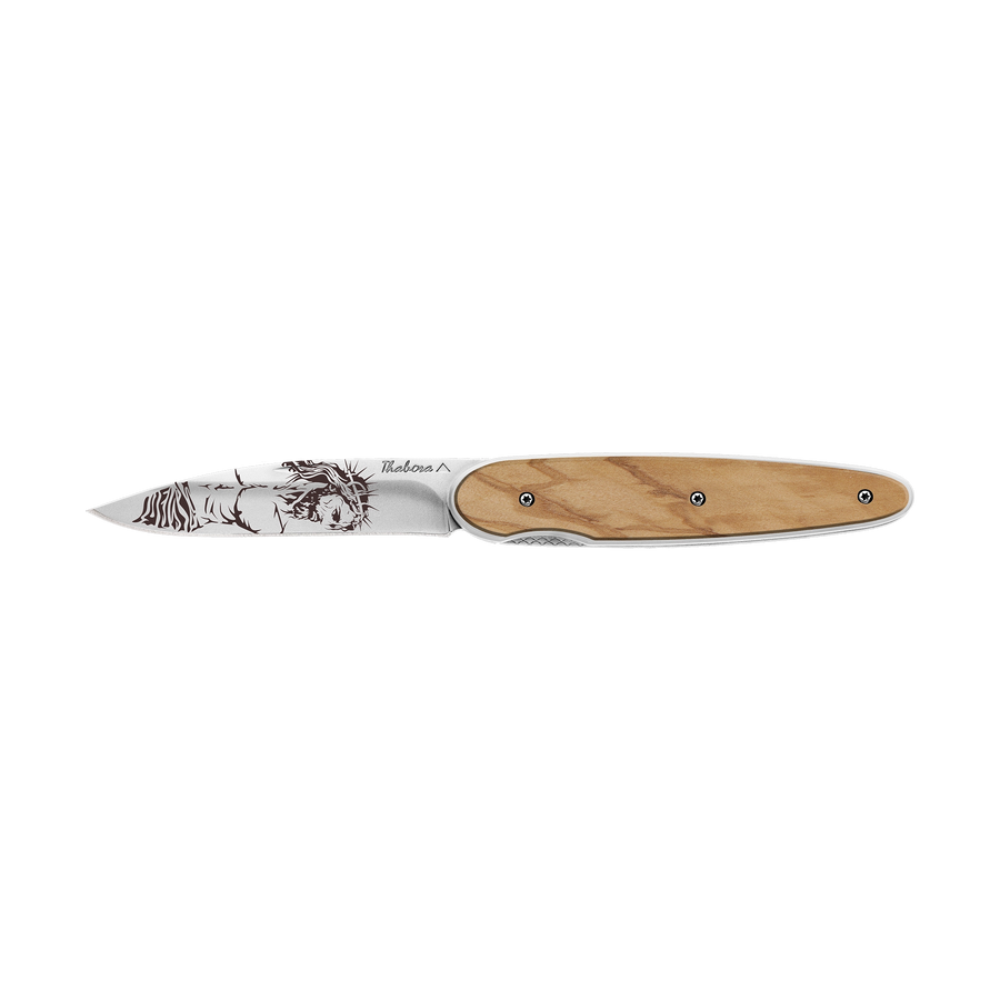 Couteau acier finition brillante plaquette pleine bois clair motif «christ»