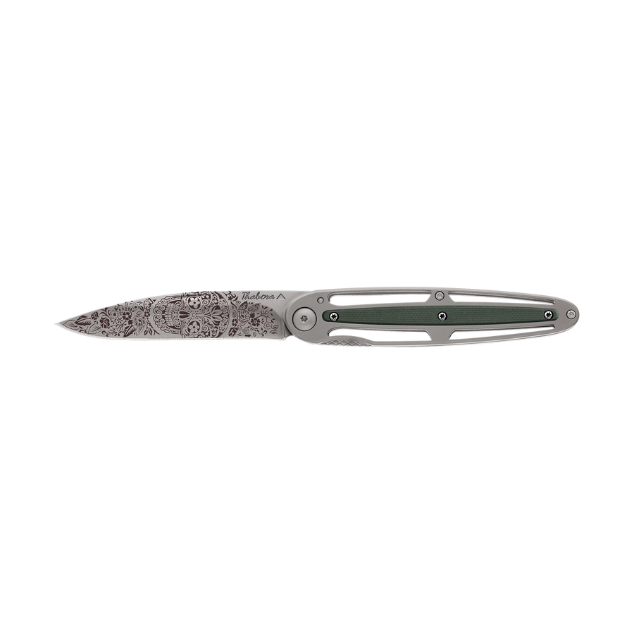 Couteau acier finition titane gris plaquette centrale résine g10 kaki motif «tête mexicaine»