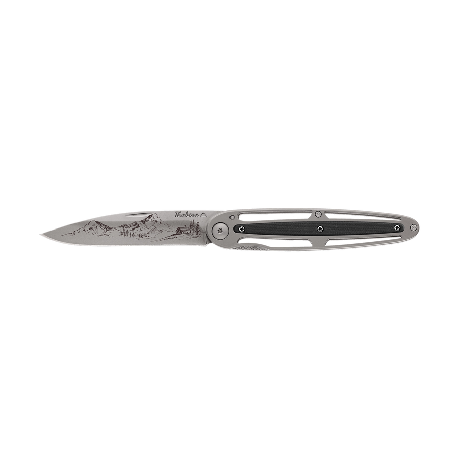 Couteau acier finition titane gris plaquette centrale résine g10 noir motif «montagne»