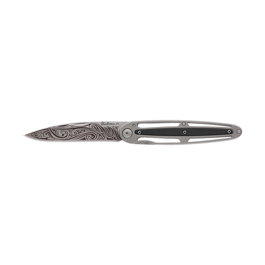 Couteau acier finition titane gris plaquette centrale résine g10 noir motif «volutes»