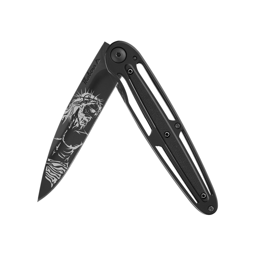 Couteau acier finition titane noir plaquette centrale résine g10 noir motif «christ»