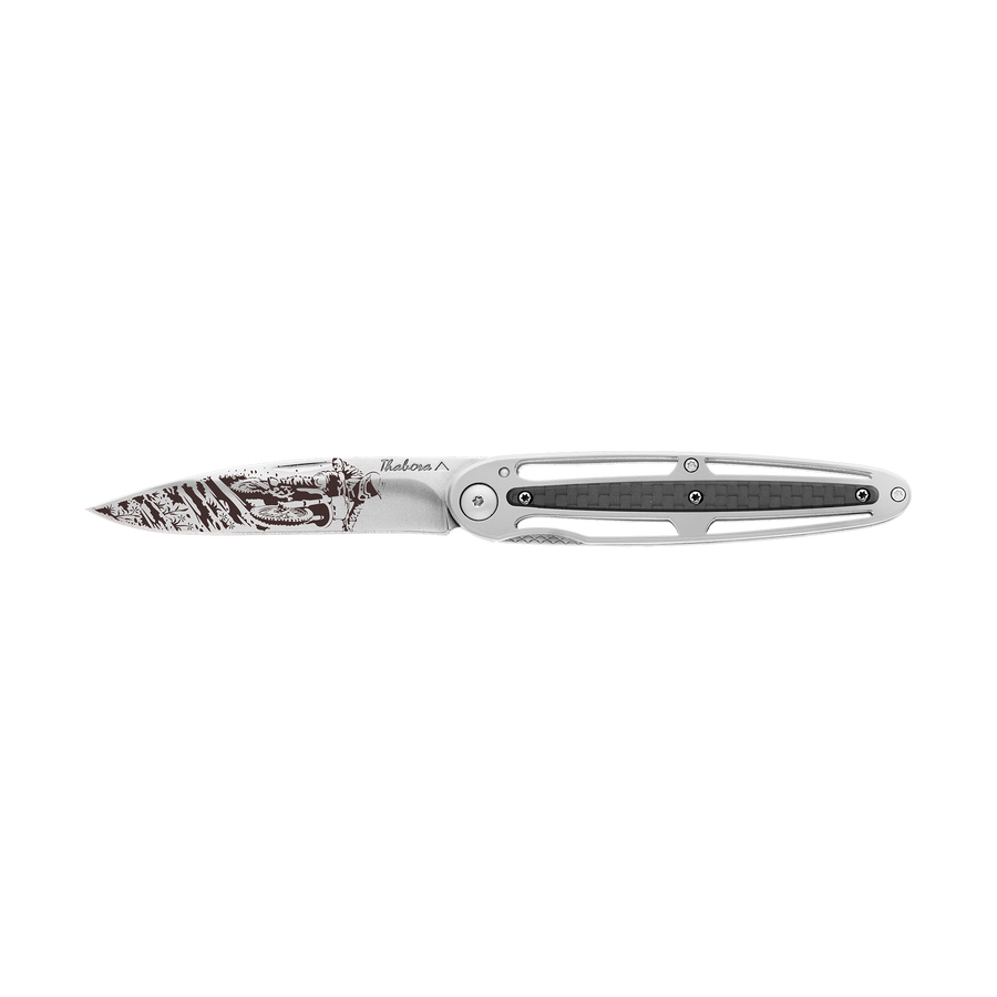 Couteau acier finition brillante plaquette centrale carbone motif «motocross»