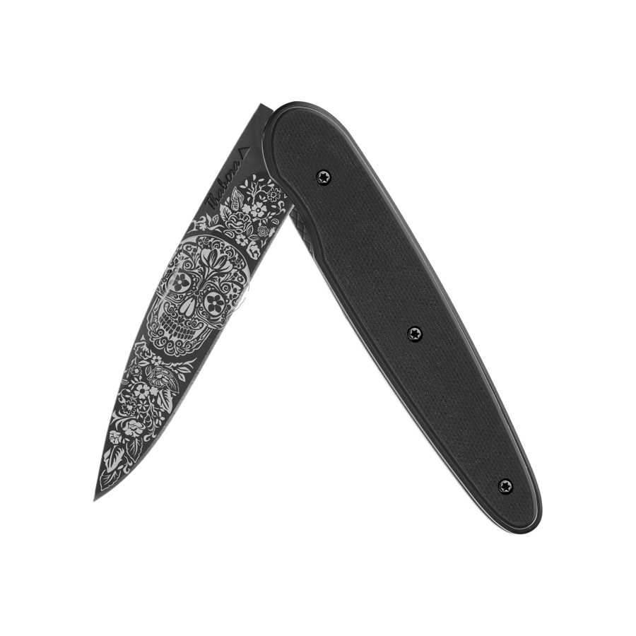 Couteau acier finition titane noir plaquette pleine résine g10 noir motif «tête mexicaine»