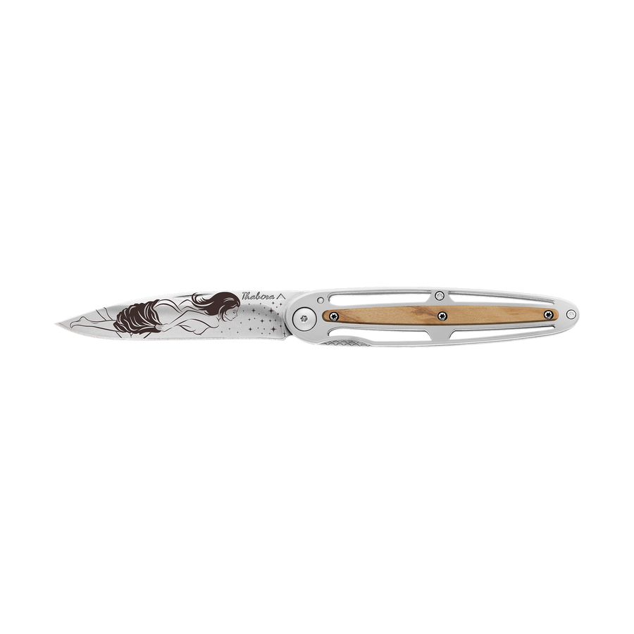 Couteau acier finition brillante plaquette centrale bois clair motif «femme dénudée»