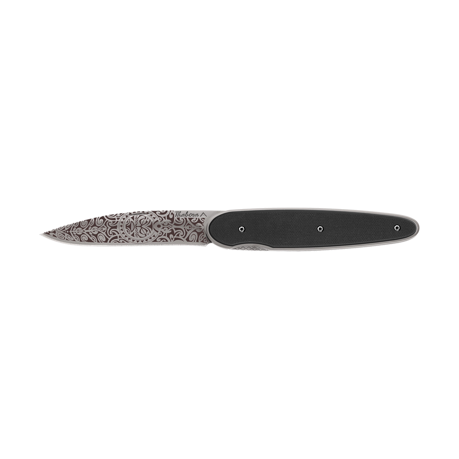 Couteau acier finition titane gris plaquette pleine résine g10 noir motif «tiki»