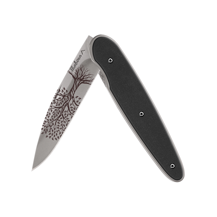 Couteau acier finition titane gris plaquette pleine résine g10 noir motif «arbre de vie»