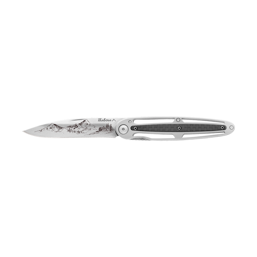 Couteau acier finition brillante plaquette centrale carbone motif «montagne»