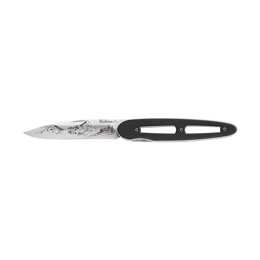 Couteau acier finition brillante plaquette ajourée résine g10 noir motif «montagne»