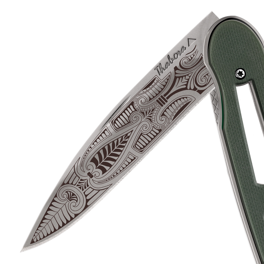 Couteau acier finition titane gris plaquette ajourée résine g10 kaki motif «cachemire»