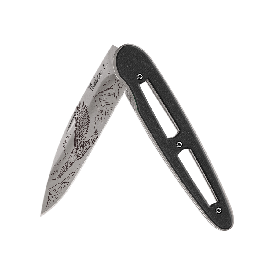 Couteau acier finition titane gris plaquette ajourée résine g10 noir motif «aigle»